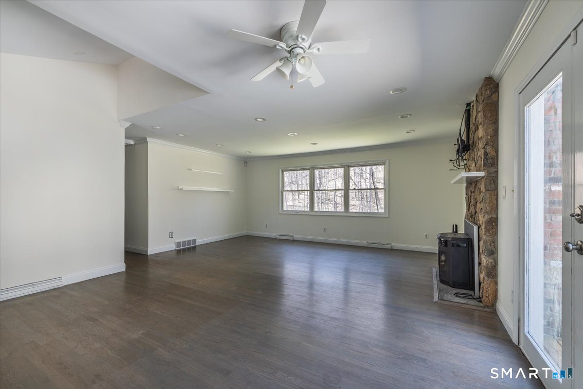 370 Quaker Farms Road Southbury, CT 06488 - Photo 7 of 35 wooden floor in an empty room with a window