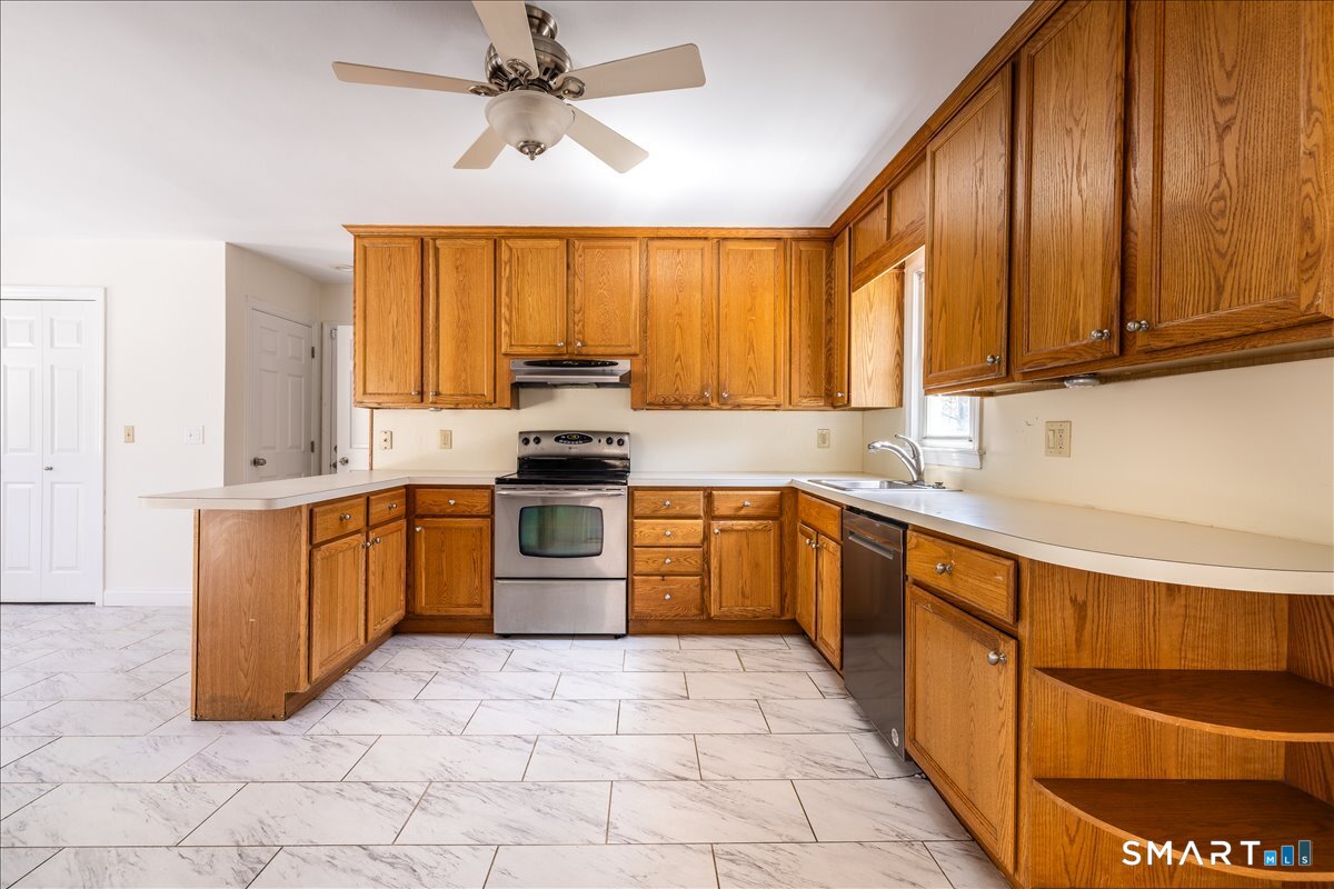 370 Quaker Farms Road Southbury, CT 06488 - Photo 9 of 35 a kitchen with a sink cabinets and window