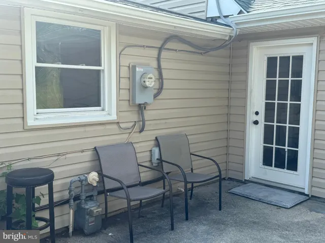 a view of a house with backyard and a window
