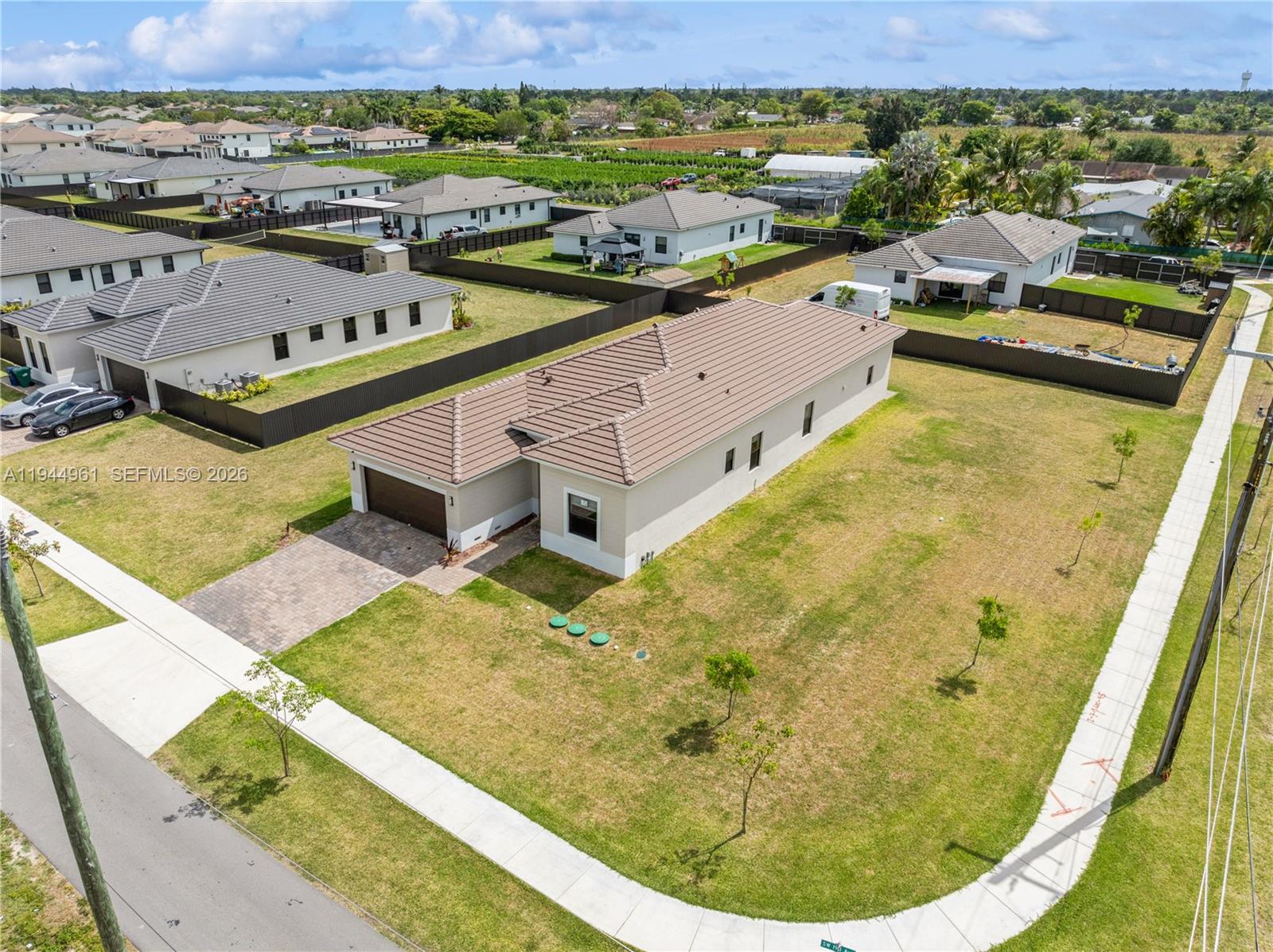 an aerial view of a house with a ocean view