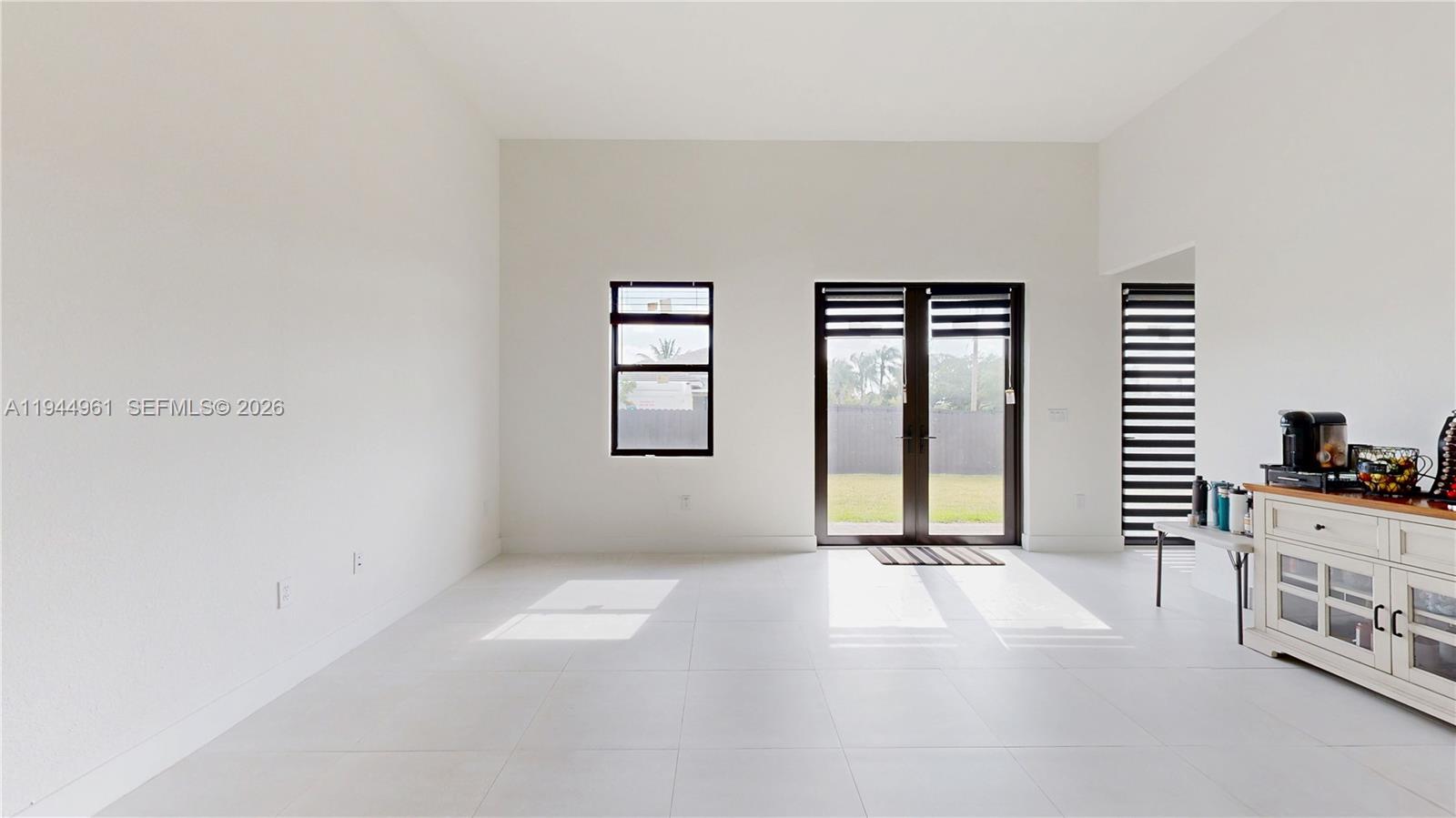 31171 Southwest 193rd Avenue Homestead, FL 33030 - Photo 12 of 36 an empty room with windows and closet
