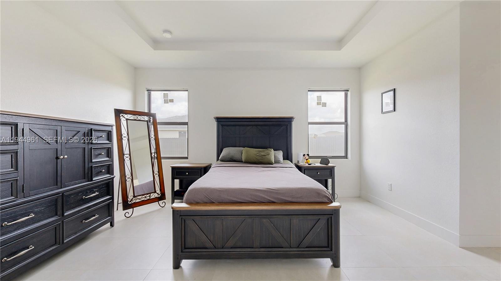 31171 Southwest 193rd Avenue Homestead, FL 33030 - Photo 14 of 36 a bedroom with a bed and dresser