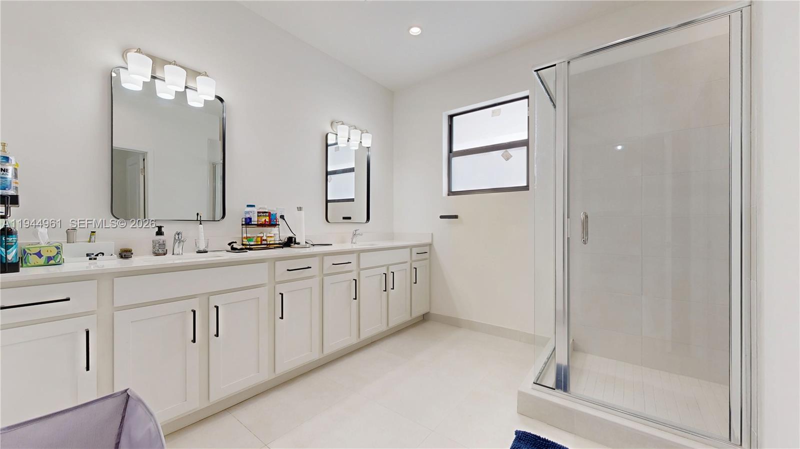 31171 Southwest 193rd Avenue Homestead, FL 33030 - Photo 17 of 36 a spacious bathroom with 2 sink and a mirror