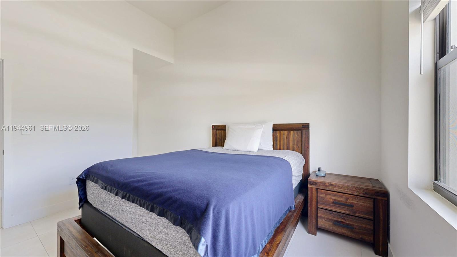 31171 Southwest 193rd Avenue Homestead, FL 33030 - Photo 20 of 36 a bedroom with a bed and a dresser