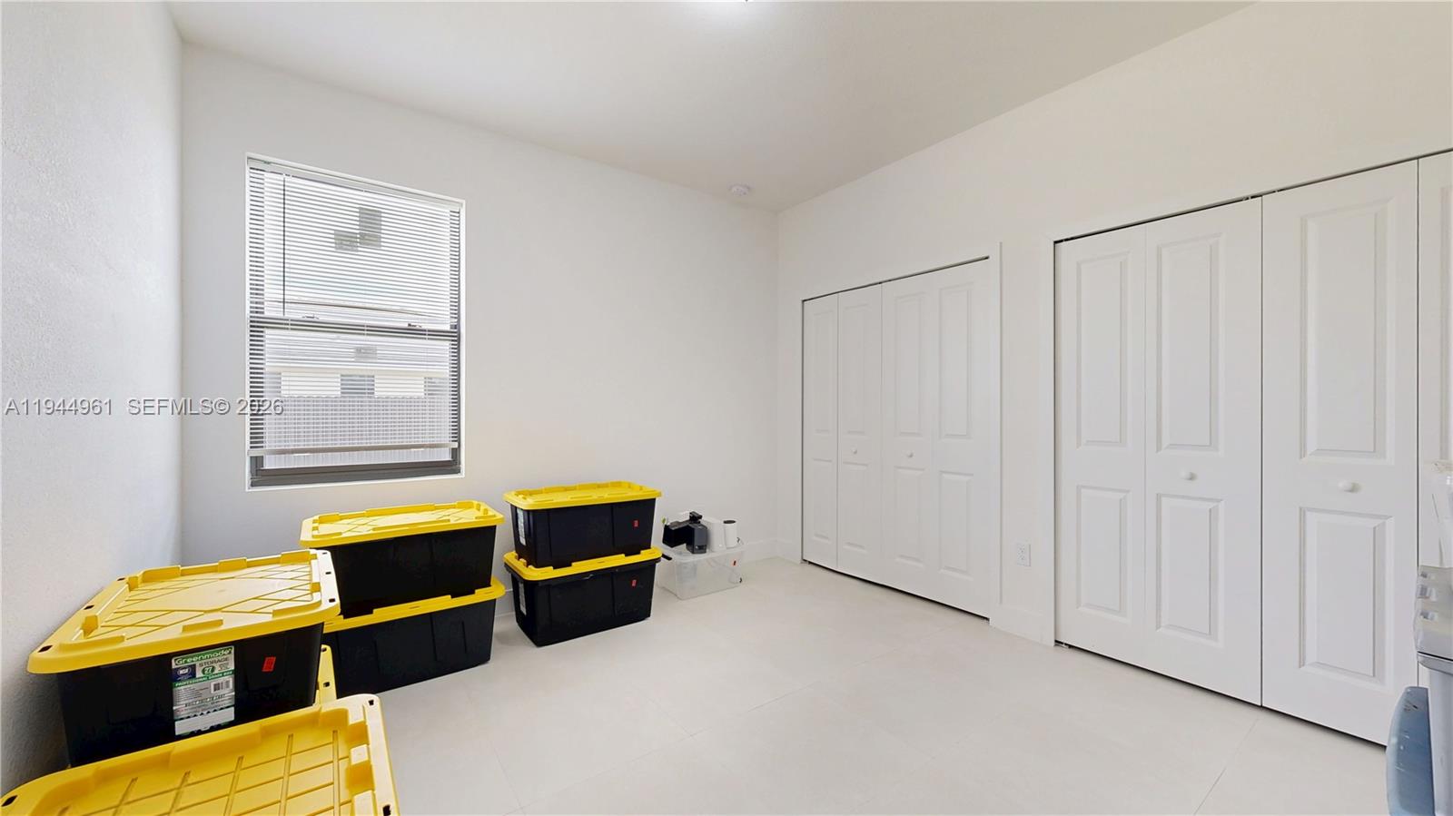 31171 Southwest 193rd Avenue Homestead, FL 33030 - Photo 22 of 36 a room with furniture and window