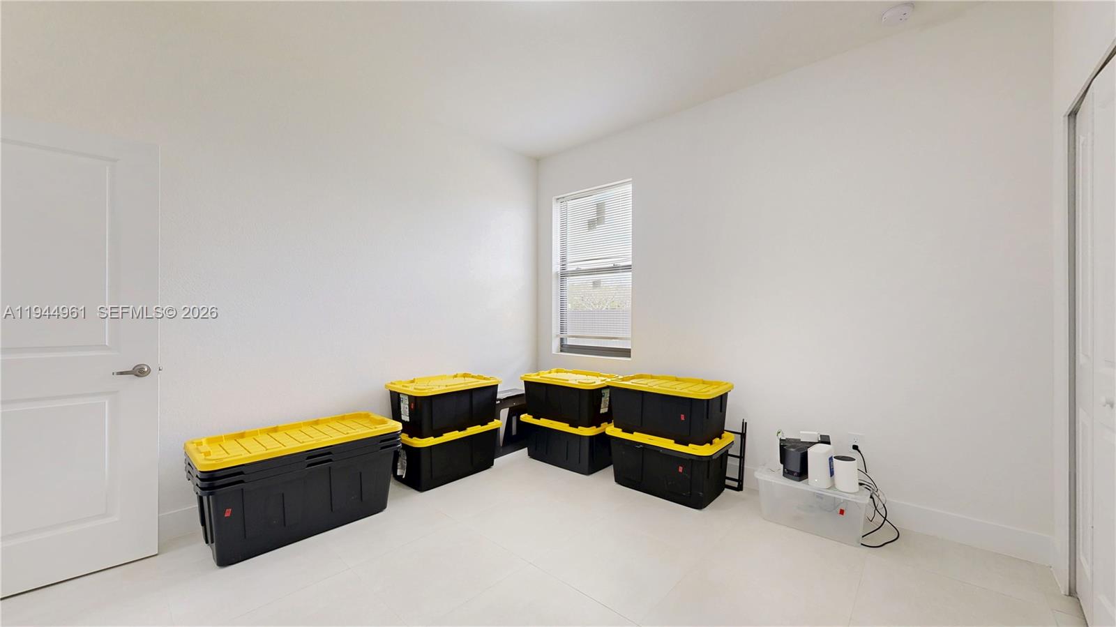 31171 Southwest 193rd Avenue Homestead, FL 33030 - Photo 23 of 36 a room with a bed and a window