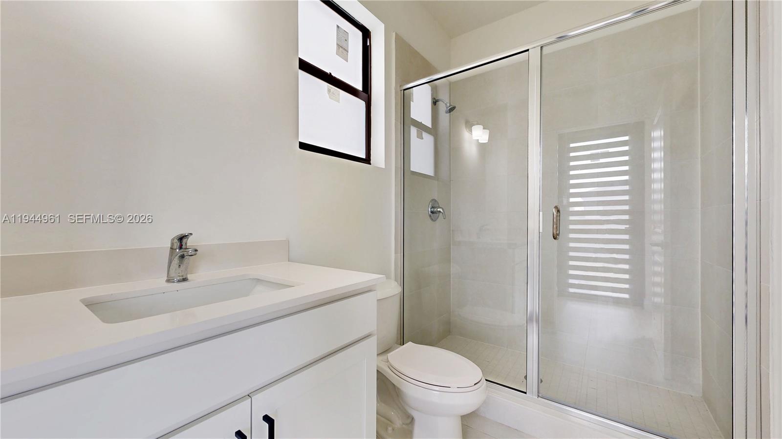 31171 Southwest 193rd Avenue Homestead, FL 33030 - Photo 27 of 36 a bathroom with a sink toilet and shower