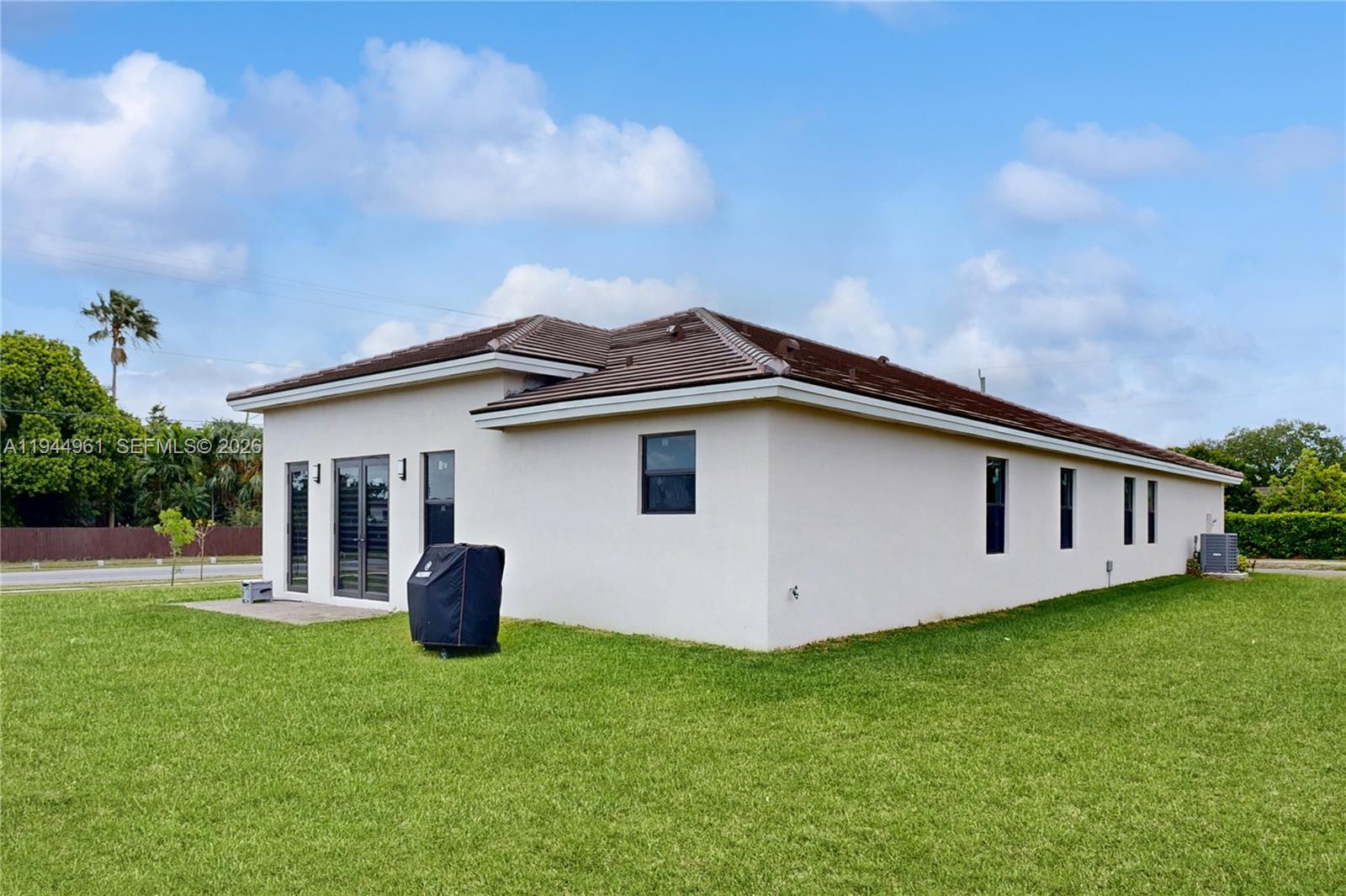 31171 Southwest 193rd Avenue Homestead, FL 33030 - Photo 31 of 36 a view of a house with backyard and garden