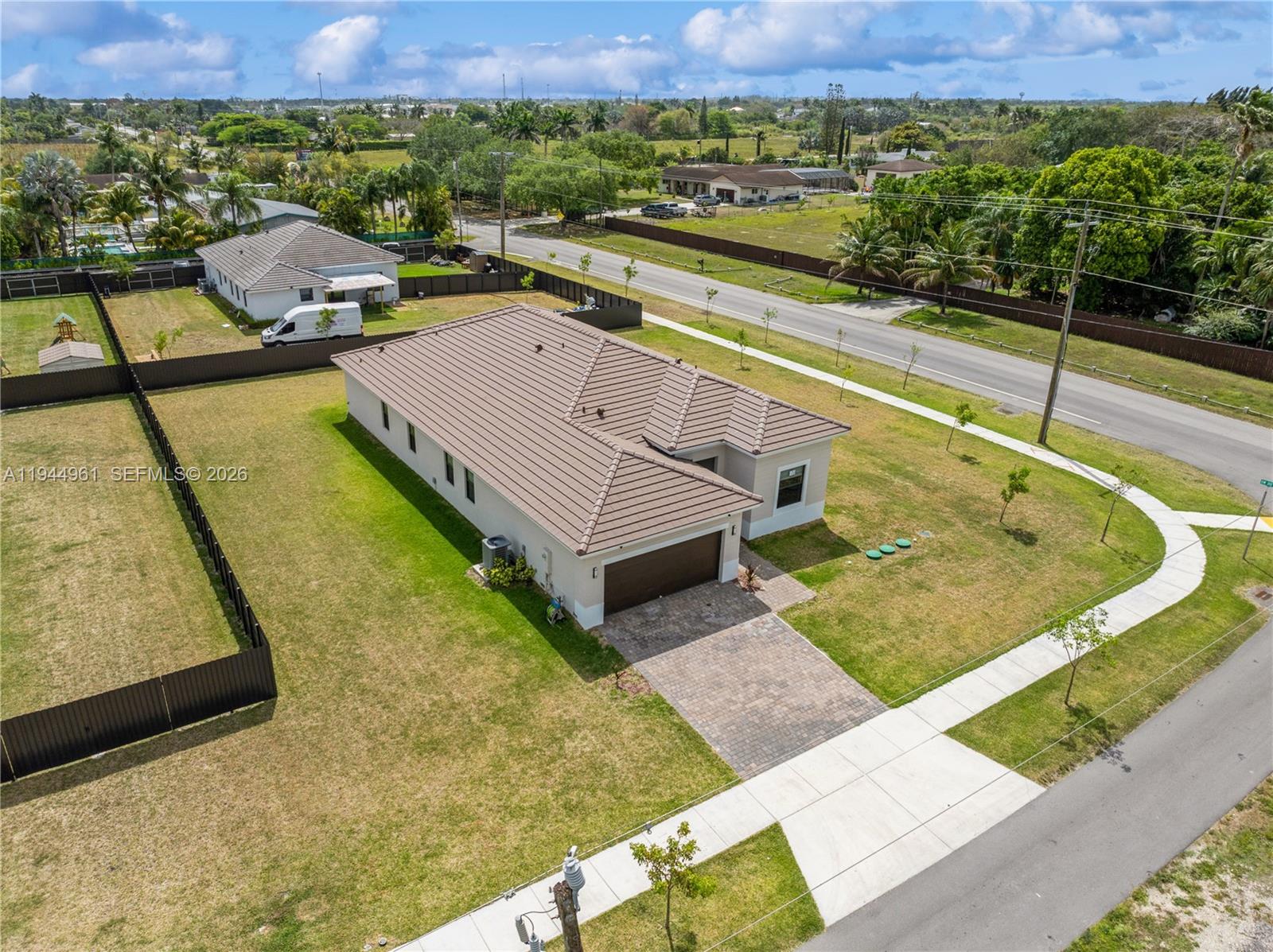 31171 Southwest 193rd Avenue Homestead, FL 33030 - Photo 32 of 36 a view of a swimming pool with a terrace