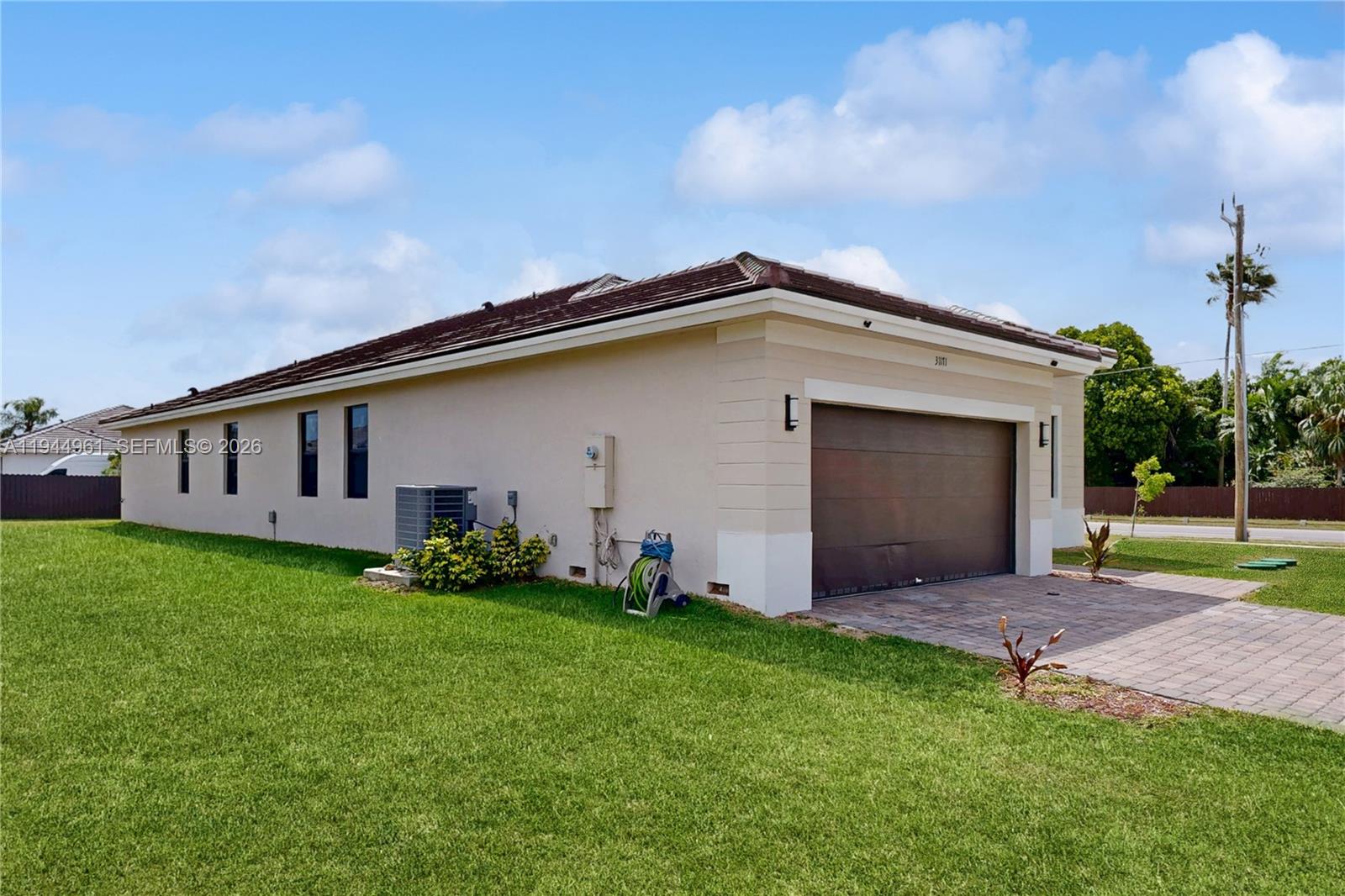 31171 Southwest 193rd Avenue Homestead, FL 33030 - Photo 4 of 36 a front view of house with yard
