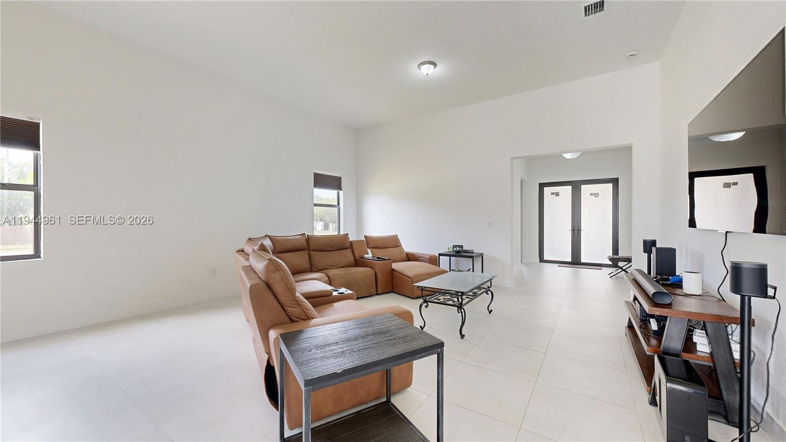 31171 Southwest 193rd Avenue Homestead, FL 33030 - Photo 6 of 36 a living room with furniture and wooden floor