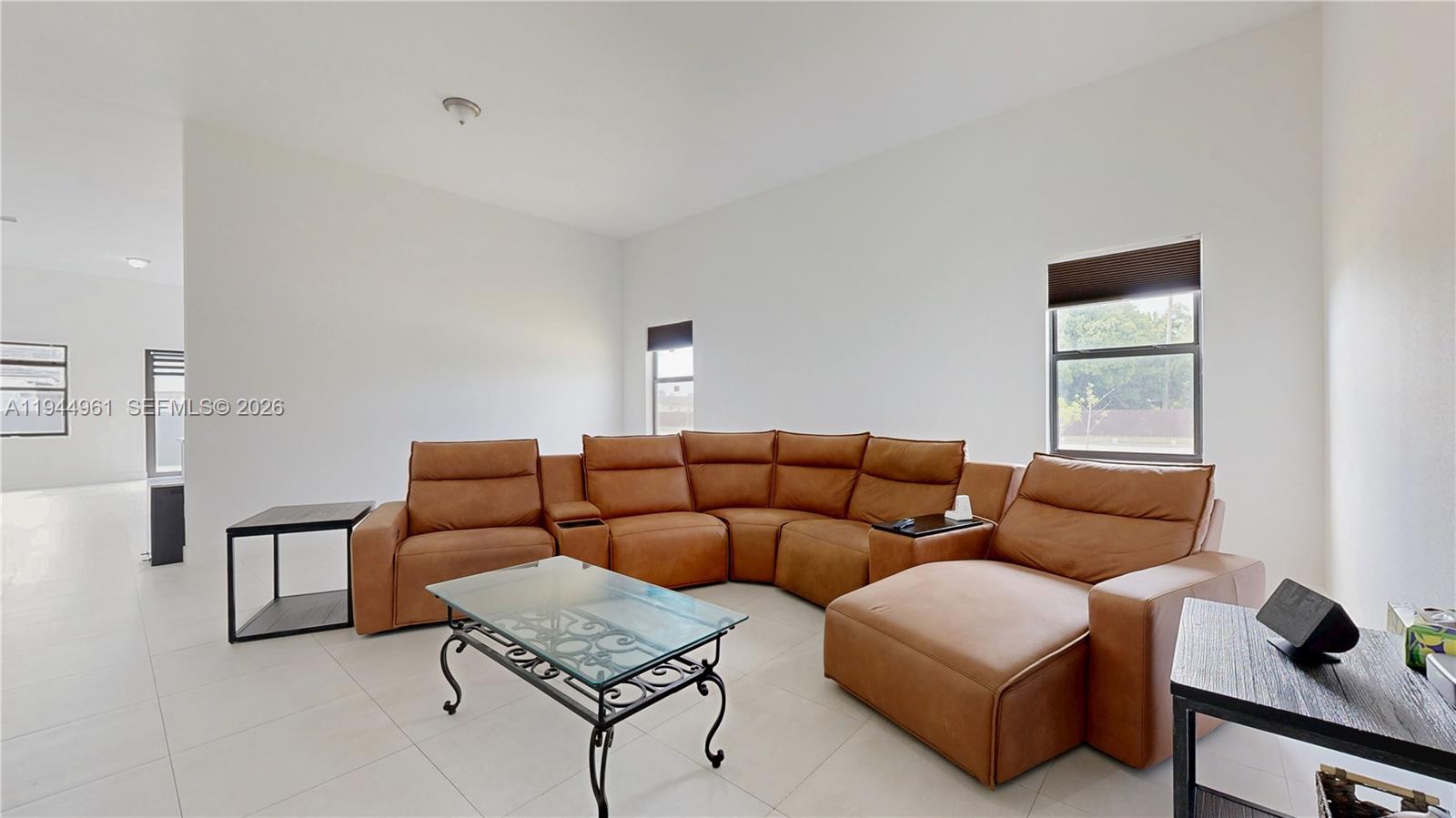 31171 Southwest 193rd Avenue Homestead, FL 33030 - Photo 8 of 36 a living room with furniture and a window