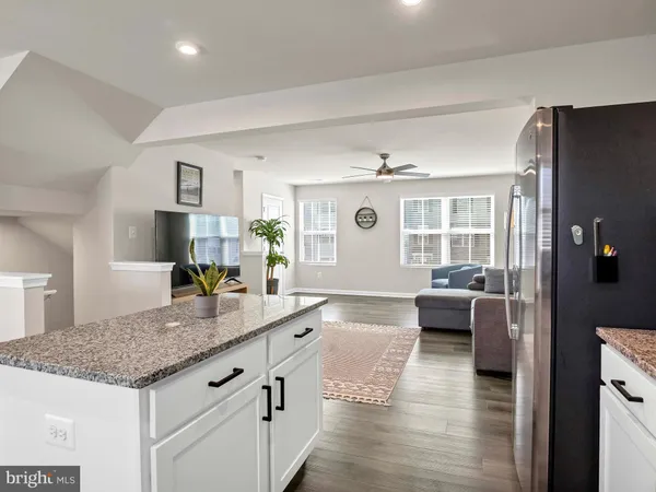 a living room with granite countertop furniture and fireplace