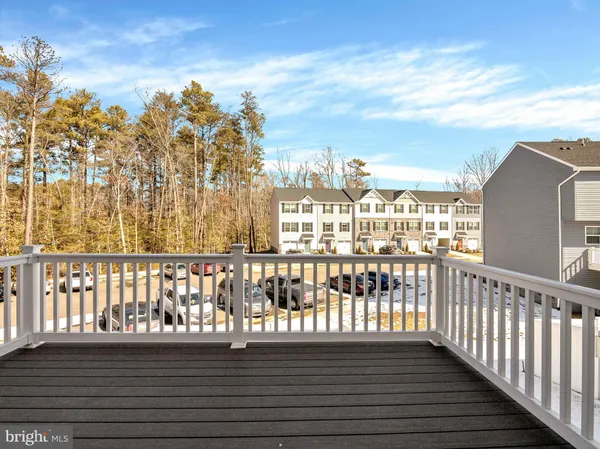 a view of a balcony with wooden floor