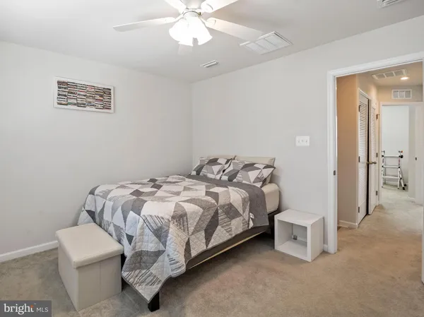 a bed room with a bed and a chandelier