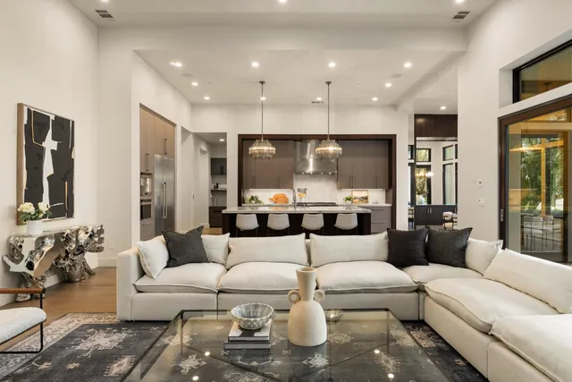 a kitchen with a sink stainless steel appliances and kitchen island