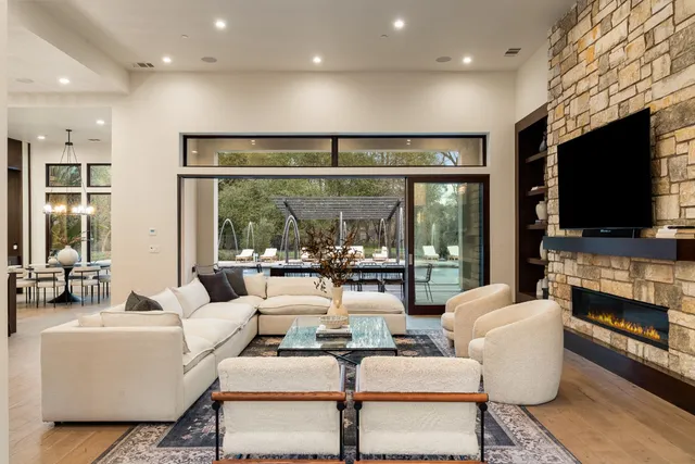 a view of a patio with table and chairs and potted plants