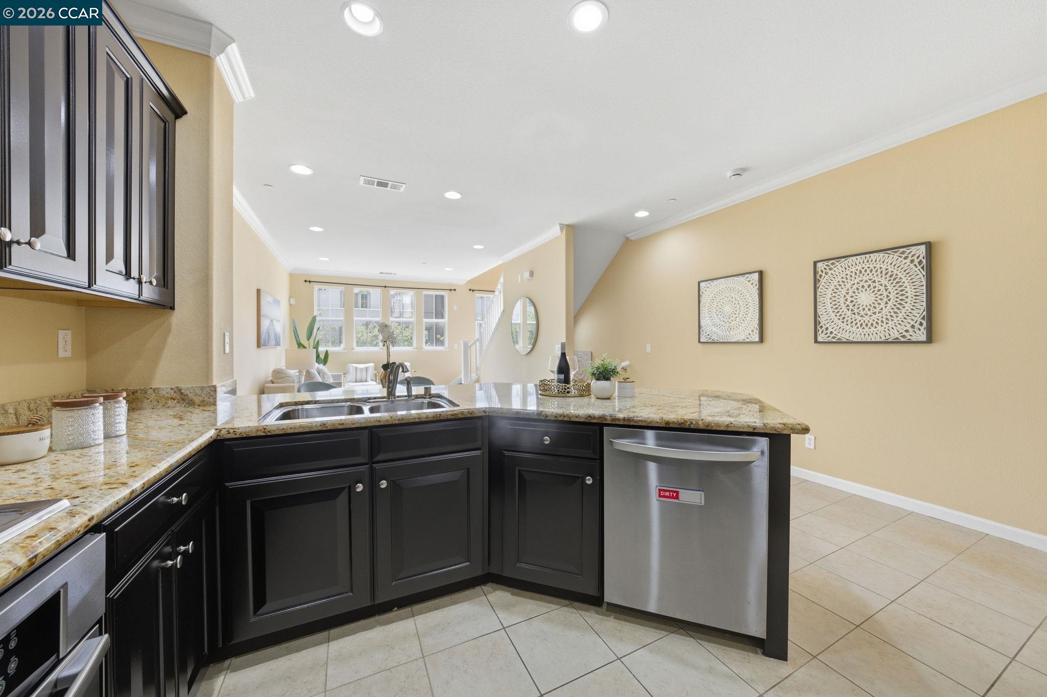 252 Sullivan Way Hayward, CA 94541 - Photo 21 of 55 a kitchen with a sink and cabinets