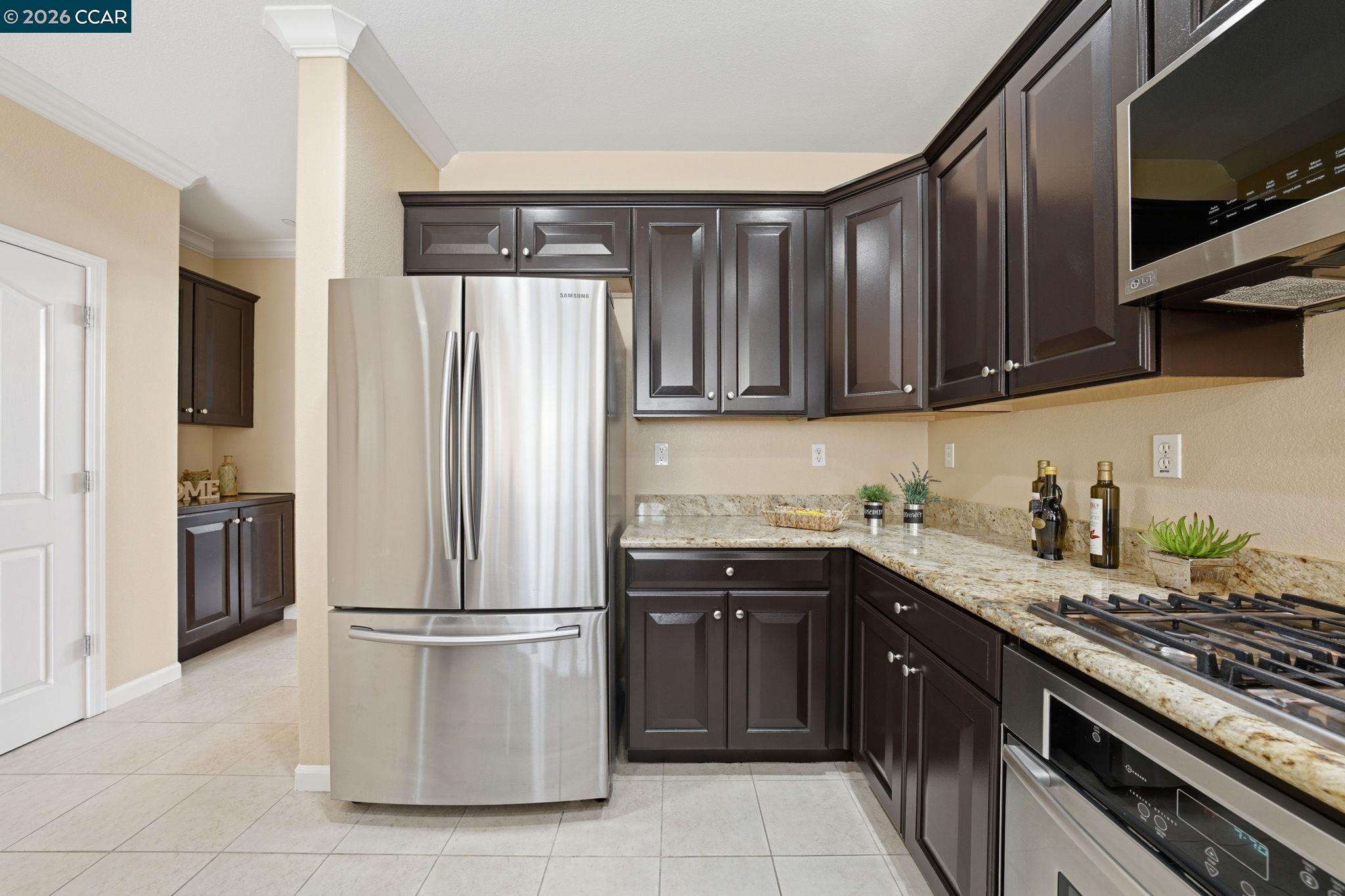 252 Sullivan Way Hayward, CA 94541 - Photo 23 of 55 a kitchen with stainless steel appliances granite countertop a stove a refrigerator and a sink
