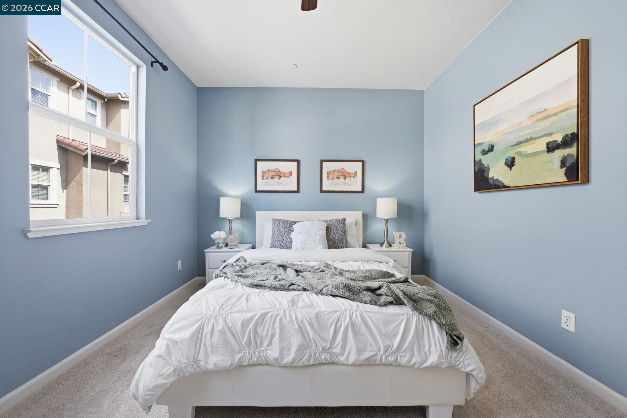 252 Sullivan Way Hayward, CA 94541 - Photo 28 of 55 a bed sitting in a bedroom next to a window