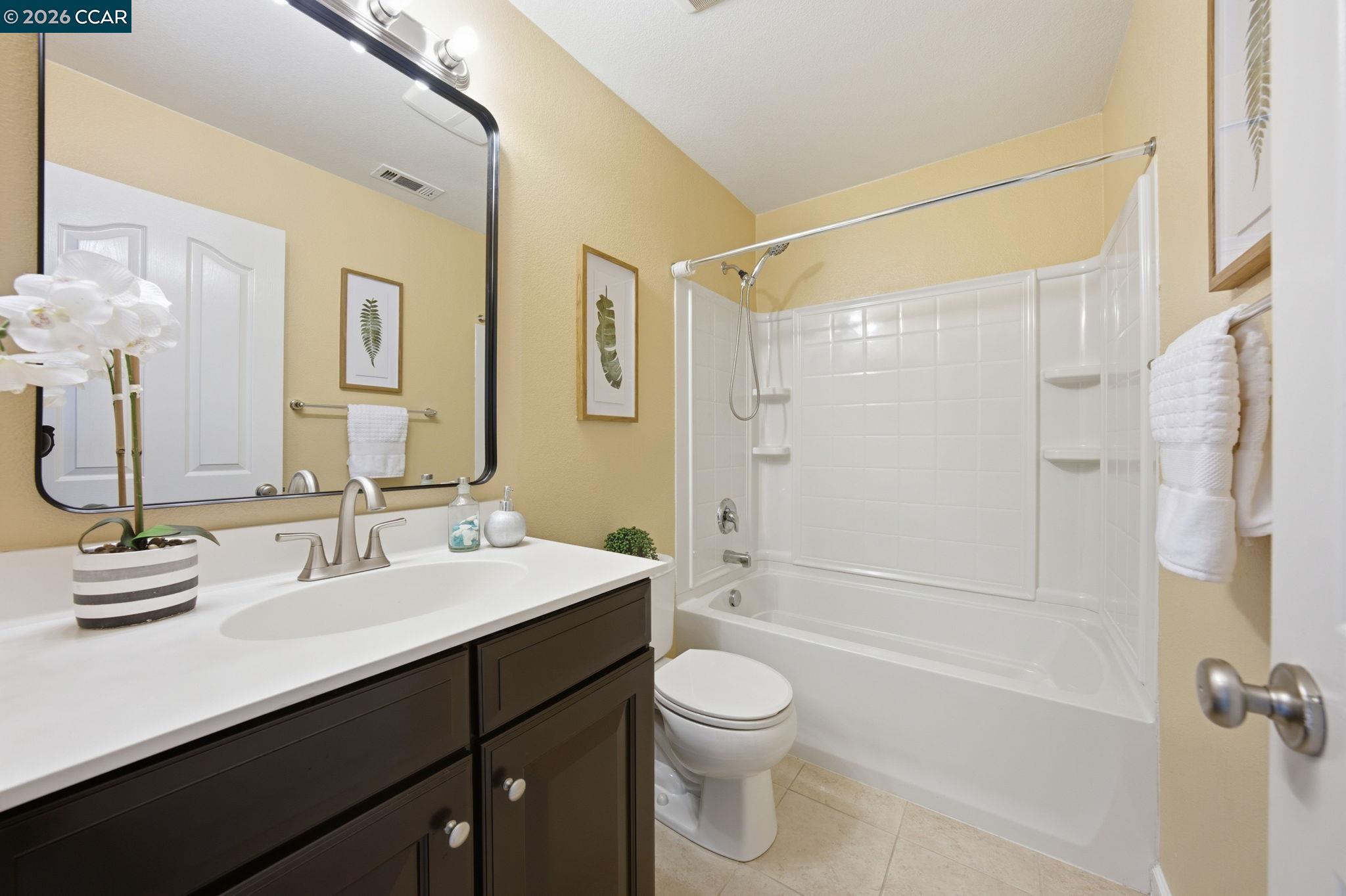 252 Sullivan Way Hayward, CA 94541 - Photo 29 of 55 a bathroom with a sink a toilet and shower