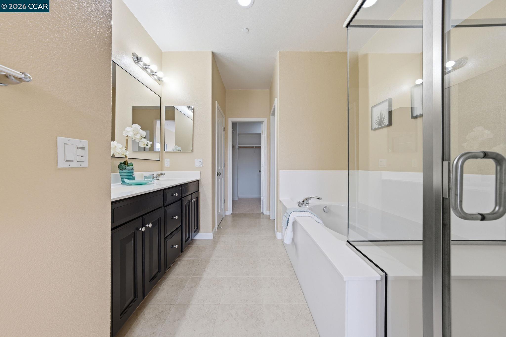 252 Sullivan Way Hayward, CA 94541 - Photo 33 of 55 a spacious bathroom with a double vanity sink a mirror and shower