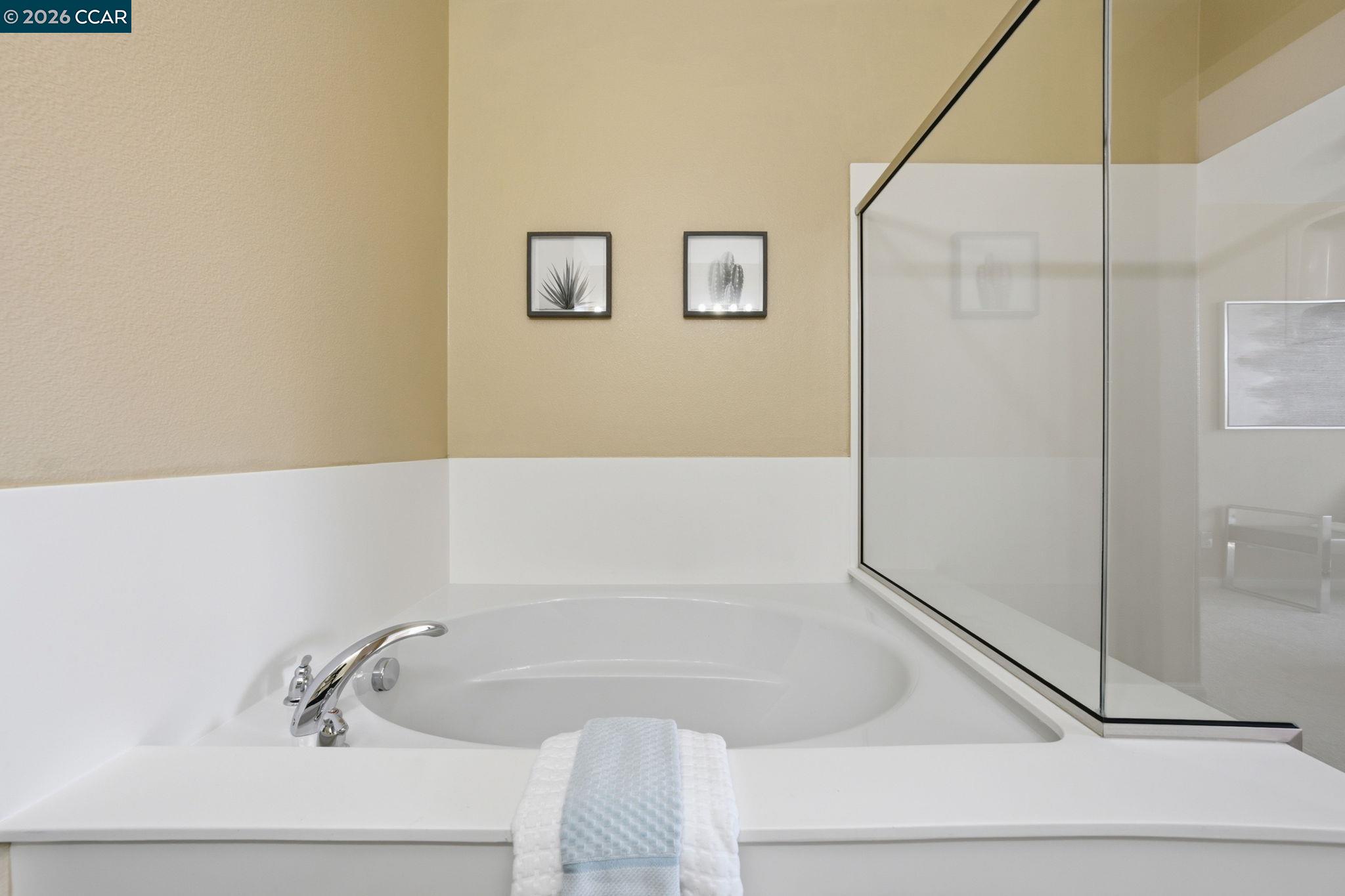 252 Sullivan Way Hayward, CA 94541 - Photo 35 of 55 a bathroom with a bathtub and a shower