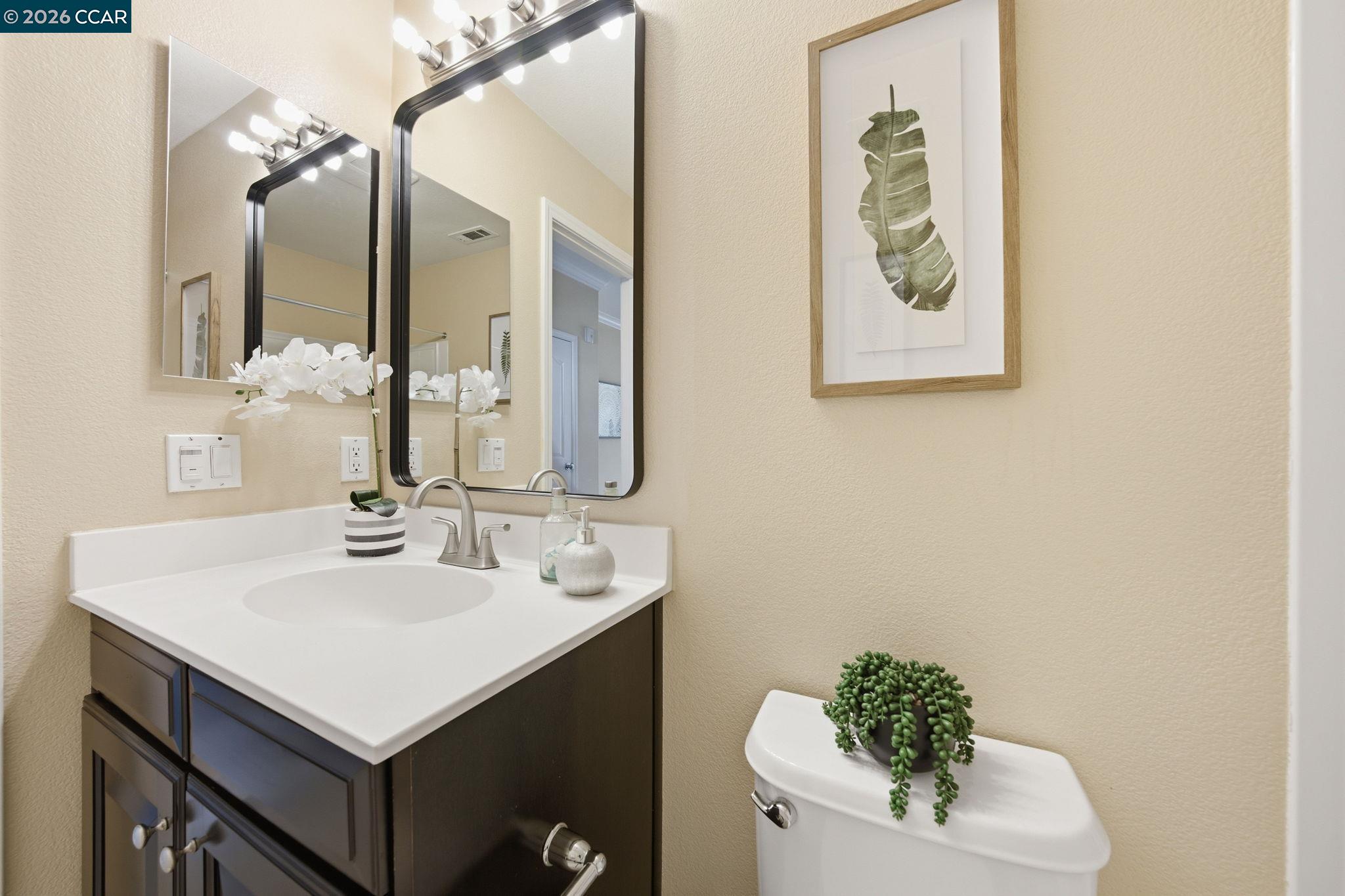 252 Sullivan Way Hayward, CA 94541 - Photo 36 of 55 a bathroom with a sink and a mirror