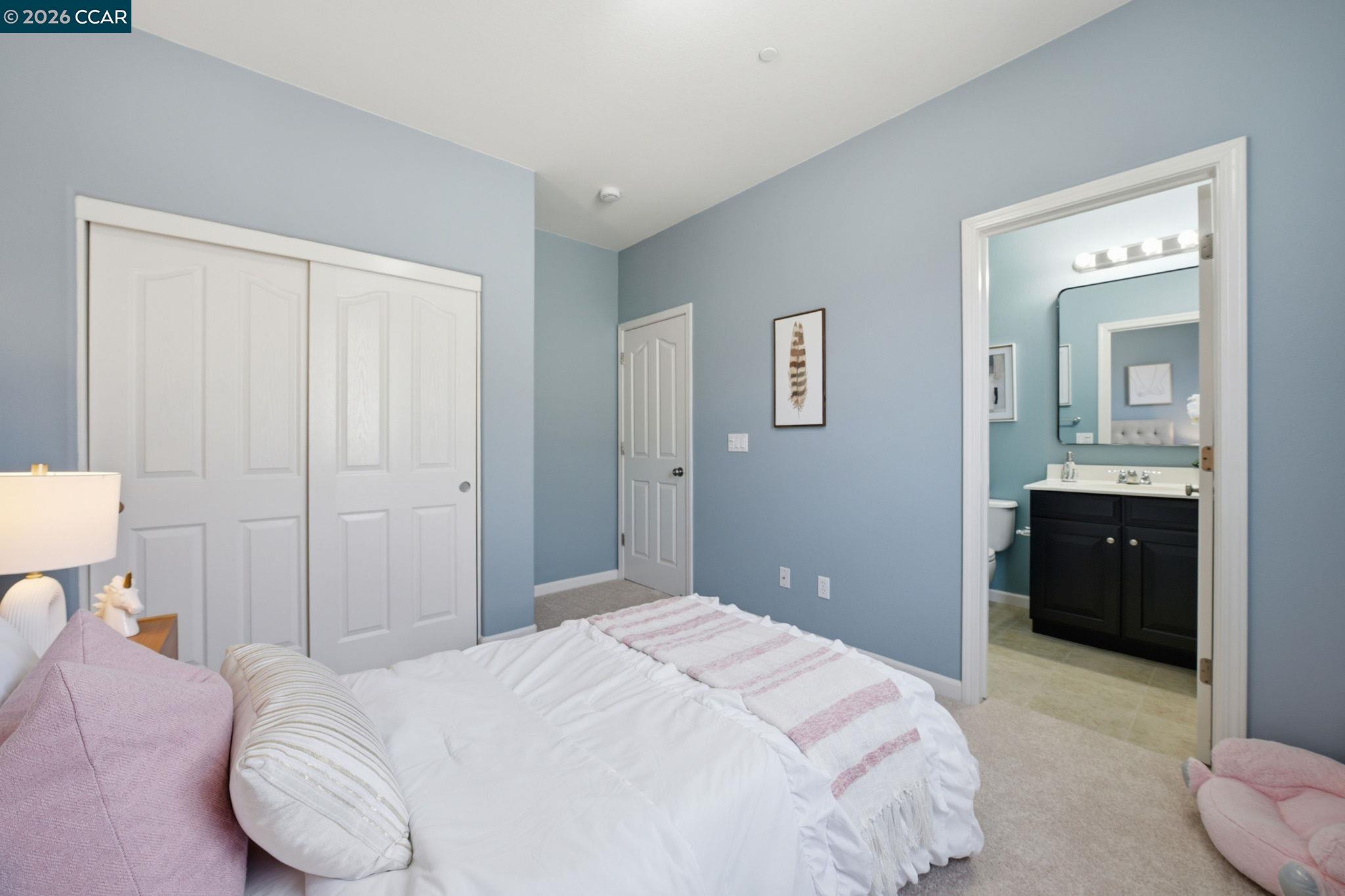 252 Sullivan Way Hayward, CA 94541 - Photo 40 of 55 a bedroom with a bed and a chandelier