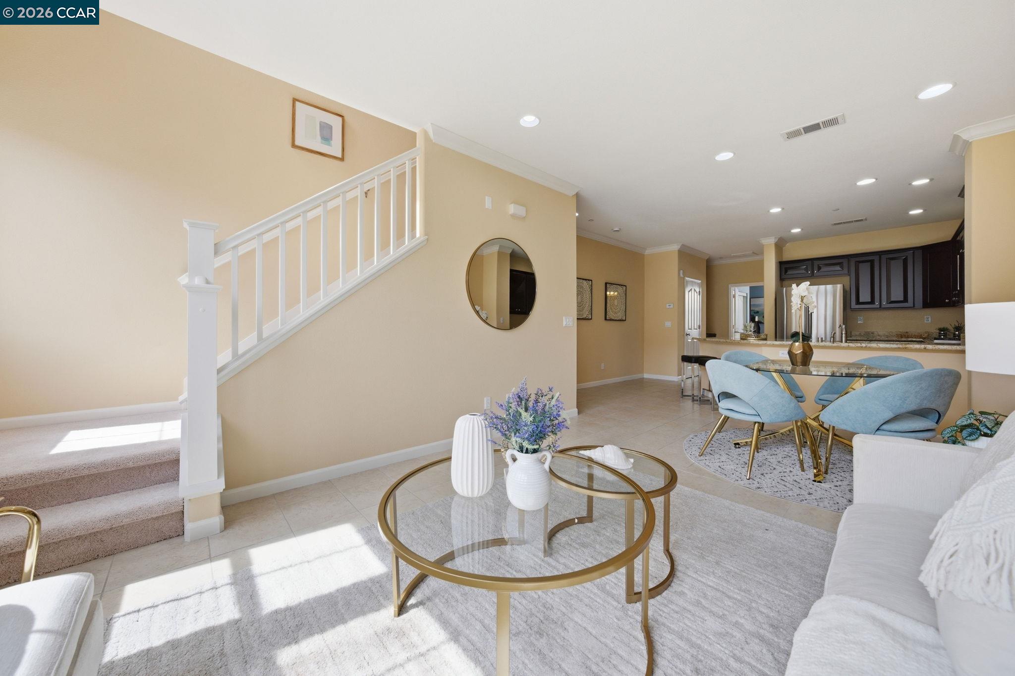 252 Sullivan Way Hayward, CA 94541 - Photo 9 of 55 a living room with furniture kitchen view and a chandelier