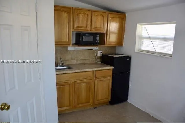 a kitchen with a stove and a microwave