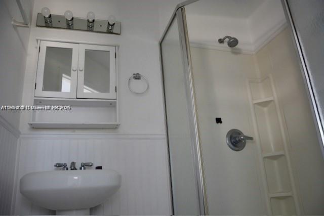 1610 Southwest 87th Court, Unit 101 Miami, FL 33165 - Photo 4 of 7 a bathroom with a sink and mirror