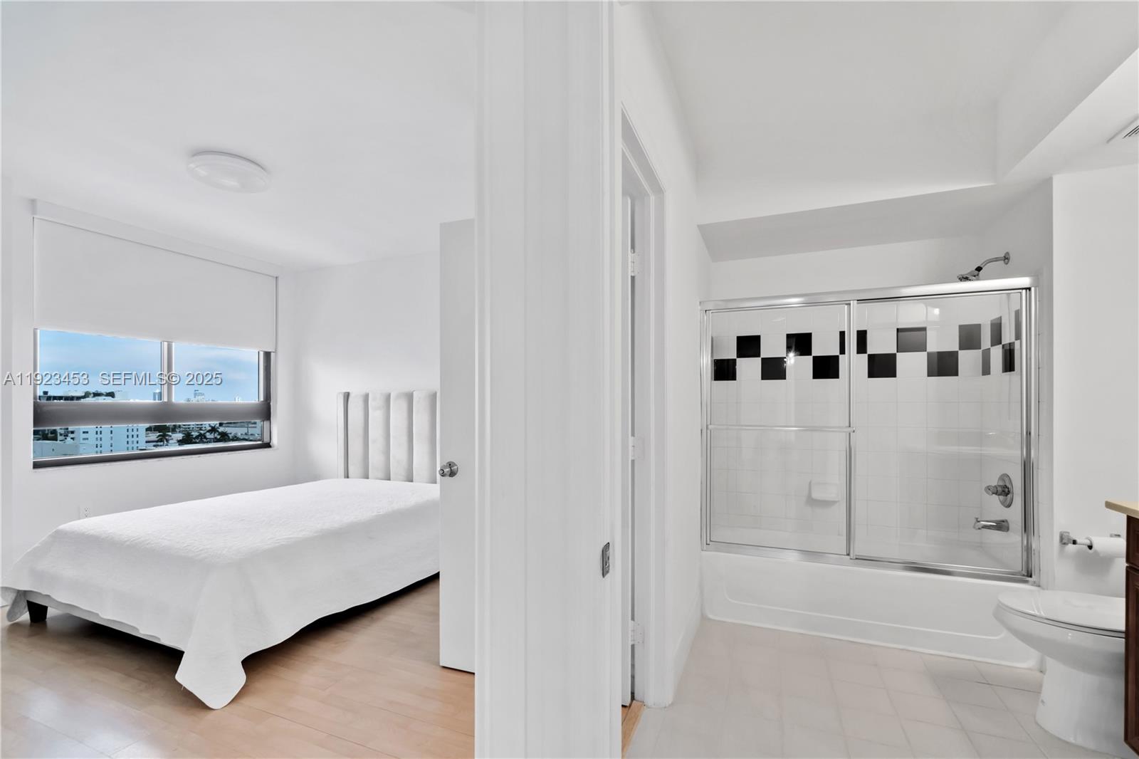 1330 West Avenue, Unit 1009 Miami Beach, FL 33139 - Photo 14 of 43 a spacious bedroom with a bed and a view of bathroom
