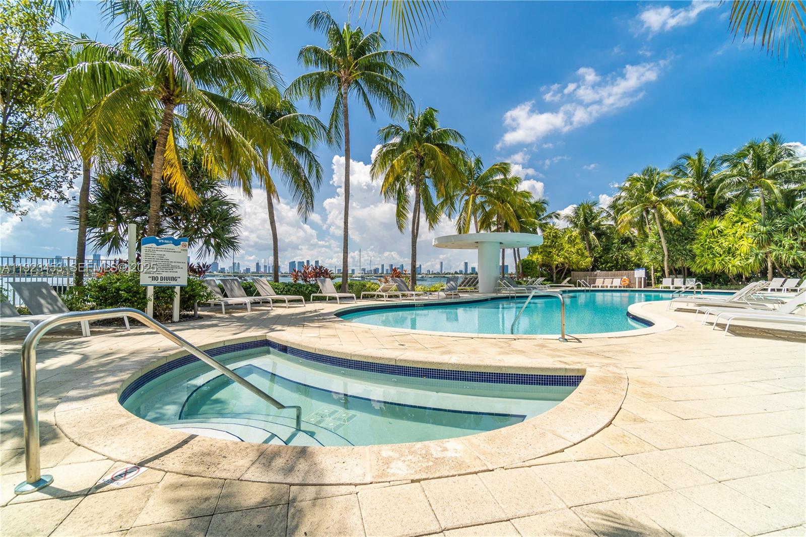 1330 West Avenue, Unit 1009 Miami Beach, FL 33139 - Photo 35 of 43 a view of a swimming pool with a patio