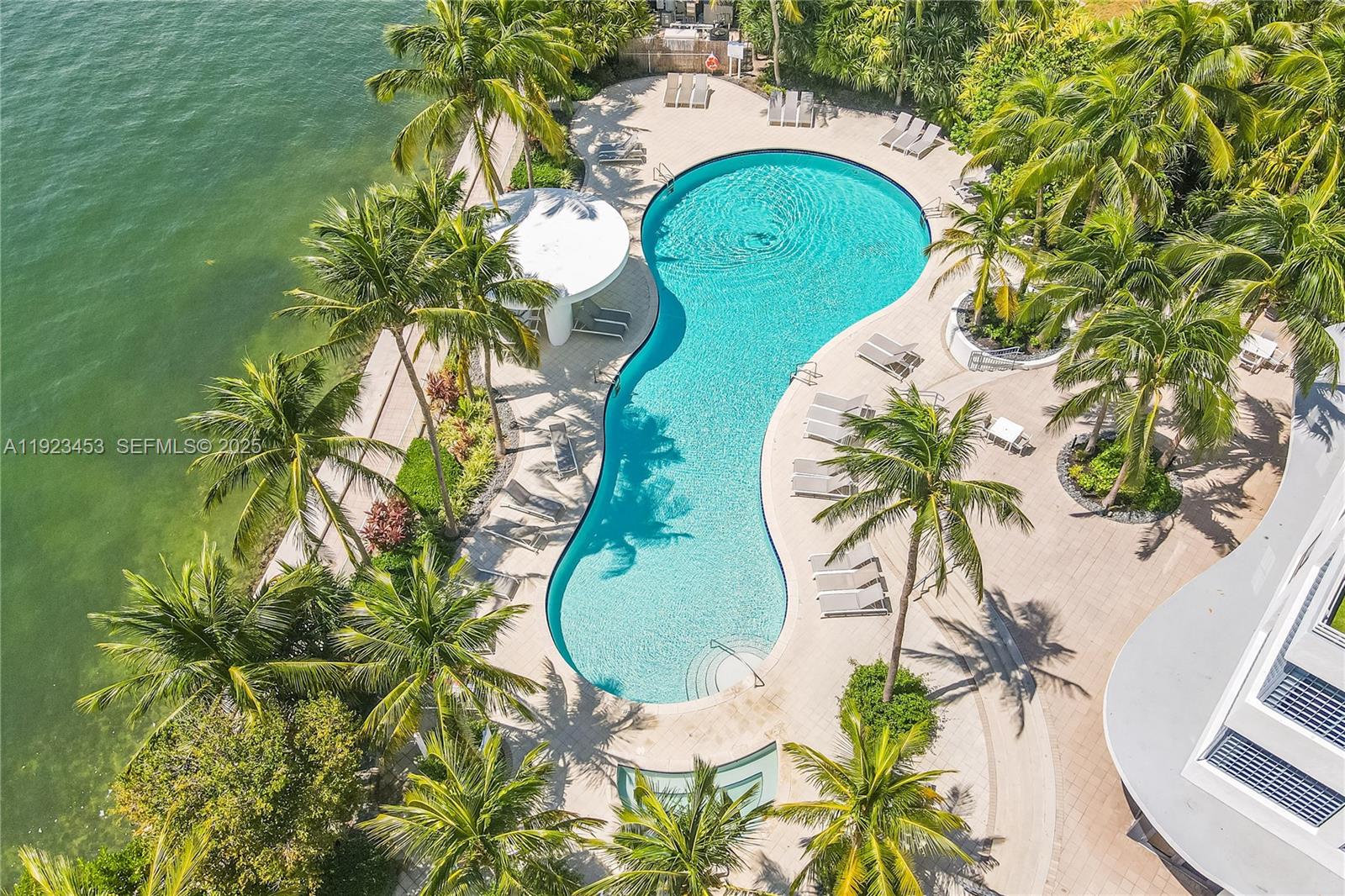 1330 West Avenue, Unit 1009 Miami Beach, FL 33139 - Photo 37 of 43 an aerial view of a swimming pool with a garden