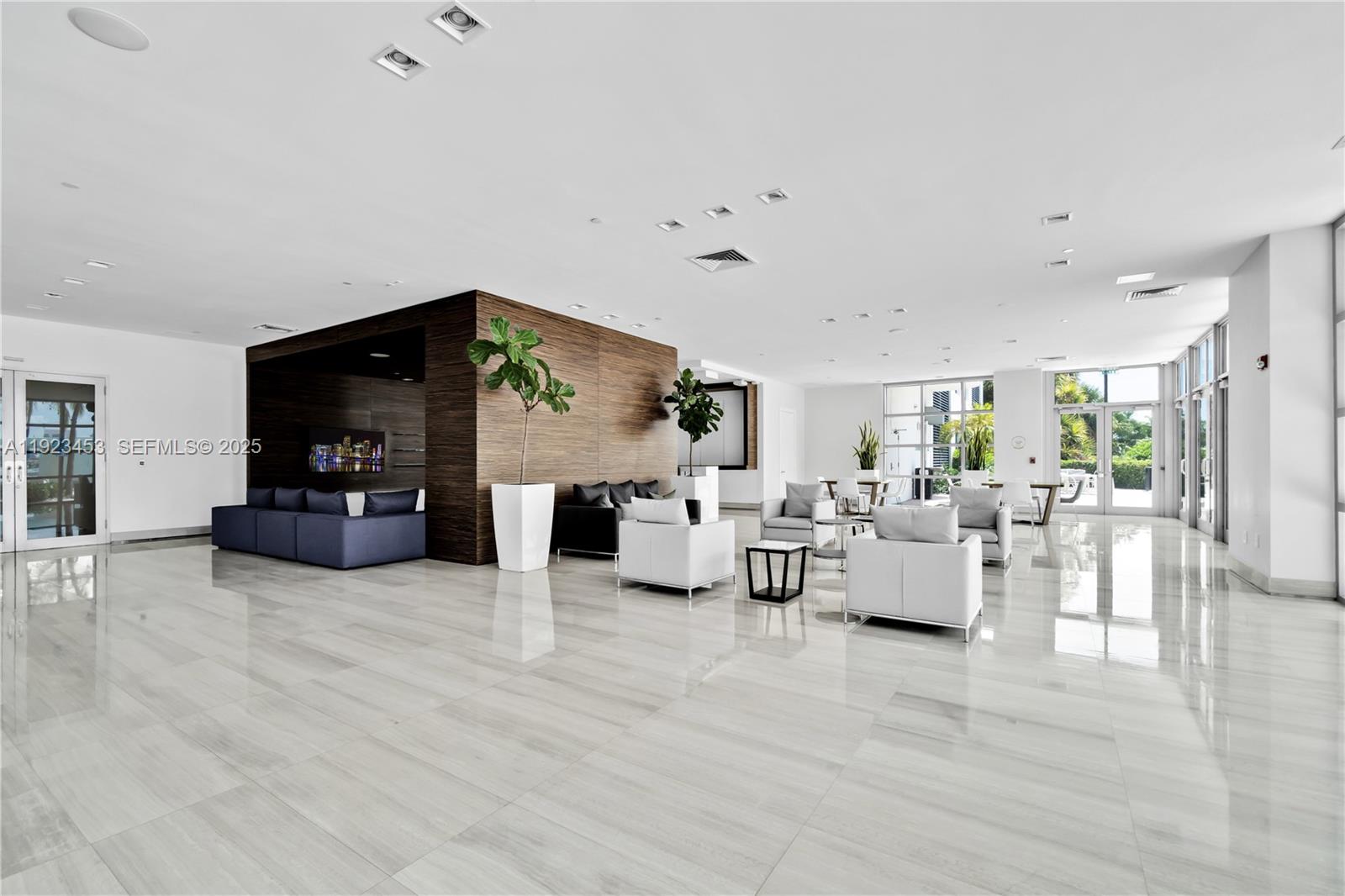 1330 West Avenue, Unit 1009 Miami Beach, FL 33139 - Photo 40 of 43 a living room with furniture and a flat screen tv