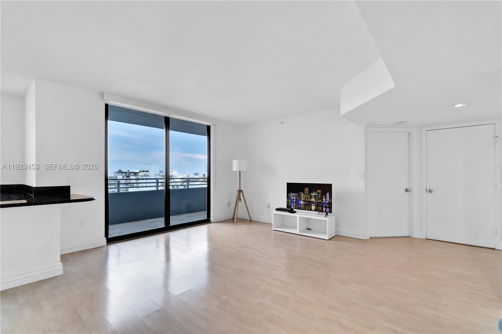 1330 West Avenue, Unit 1009 Miami Beach, FL 33139 - Photo 9 of 43 a view of an empty room with a window