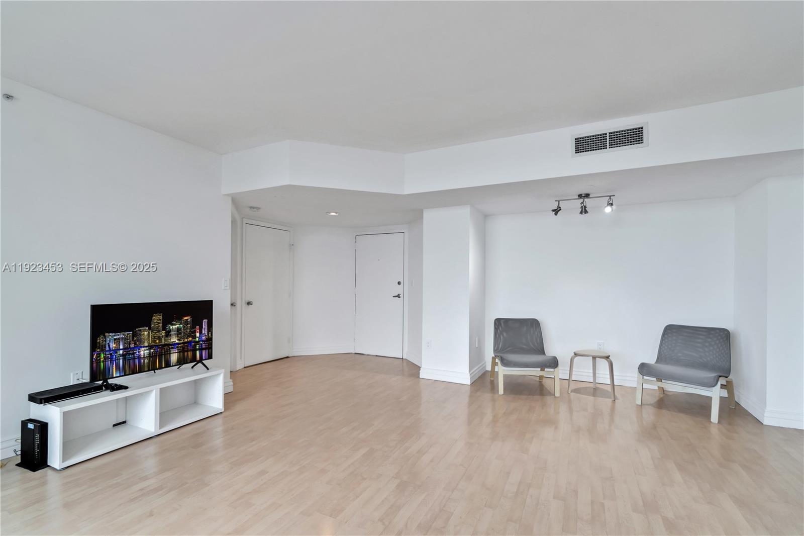 1330 West Avenue, Unit 1009 Miami Beach, FL 33139 - Photo 10 of 43 a living room with furniture and a fireplace