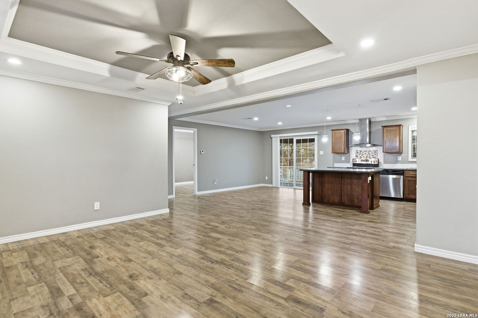 2383 Tomblin Road Bigfoot, TX 78005 - Photo 11 of 61 a view of kitchen and kitchen with stainless steel appliances wooden floor