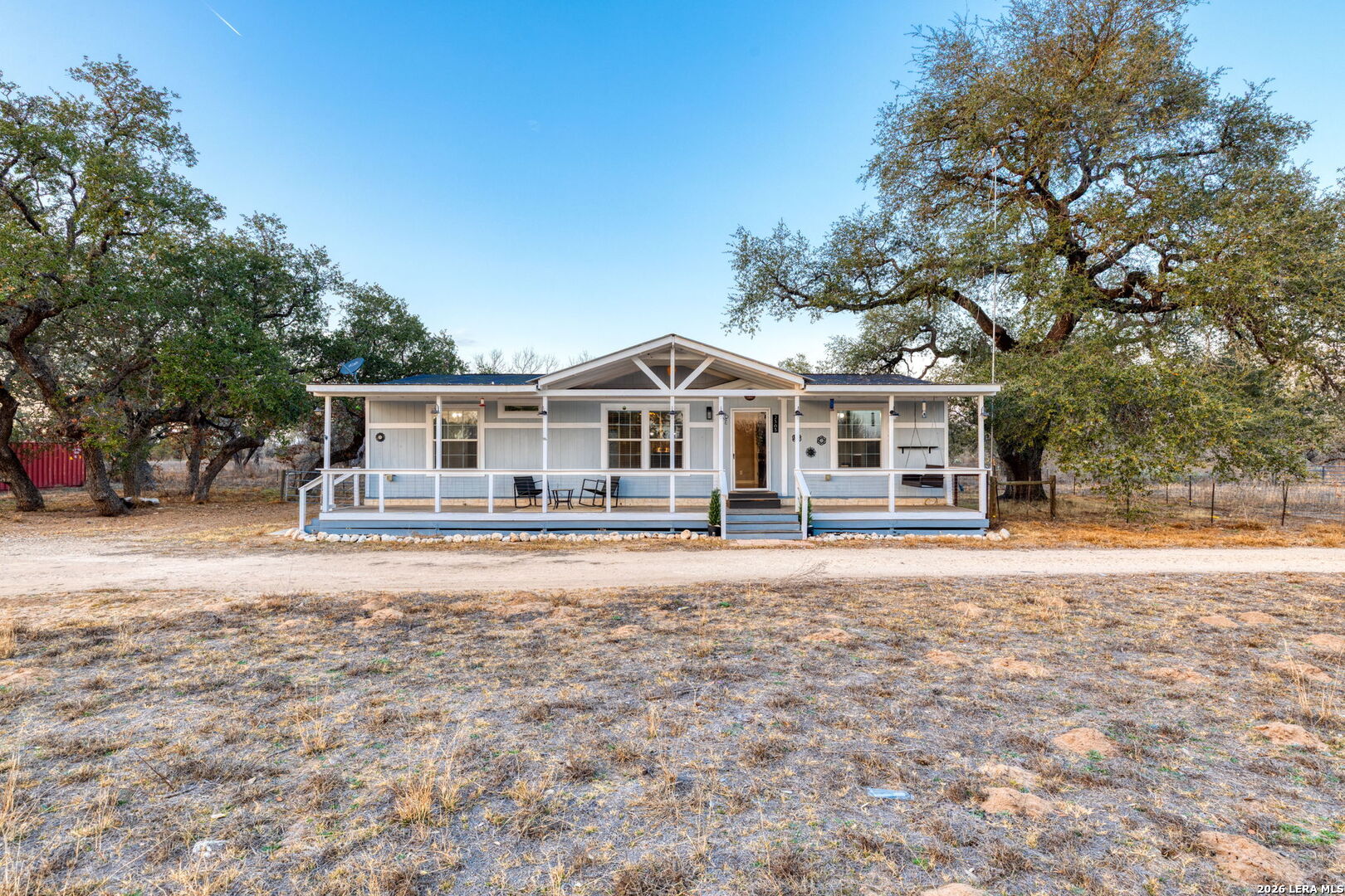 2383 Tomblin Road Bigfoot, TX 78005 - Photo 4 of 61 a front view of a house with a garden