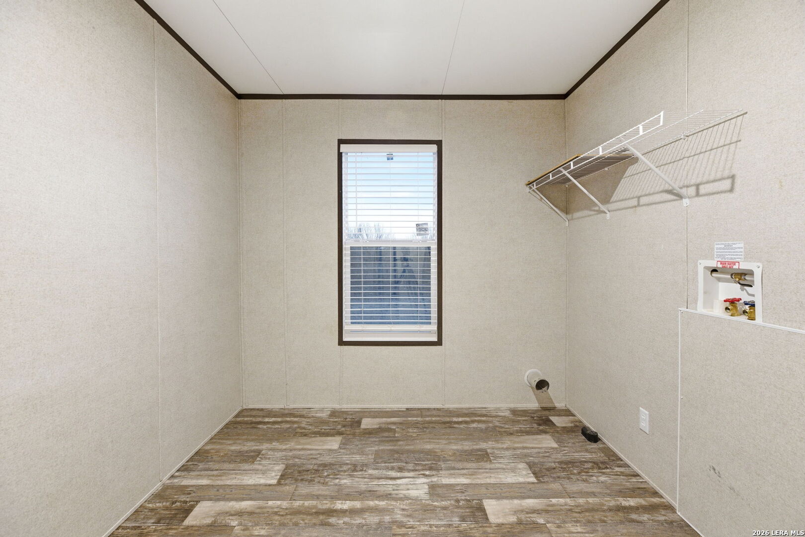 2383 Tomblin Road Bigfoot, TX 78005 - Photo 43 of 61 a view of a room with wooden floor and windows