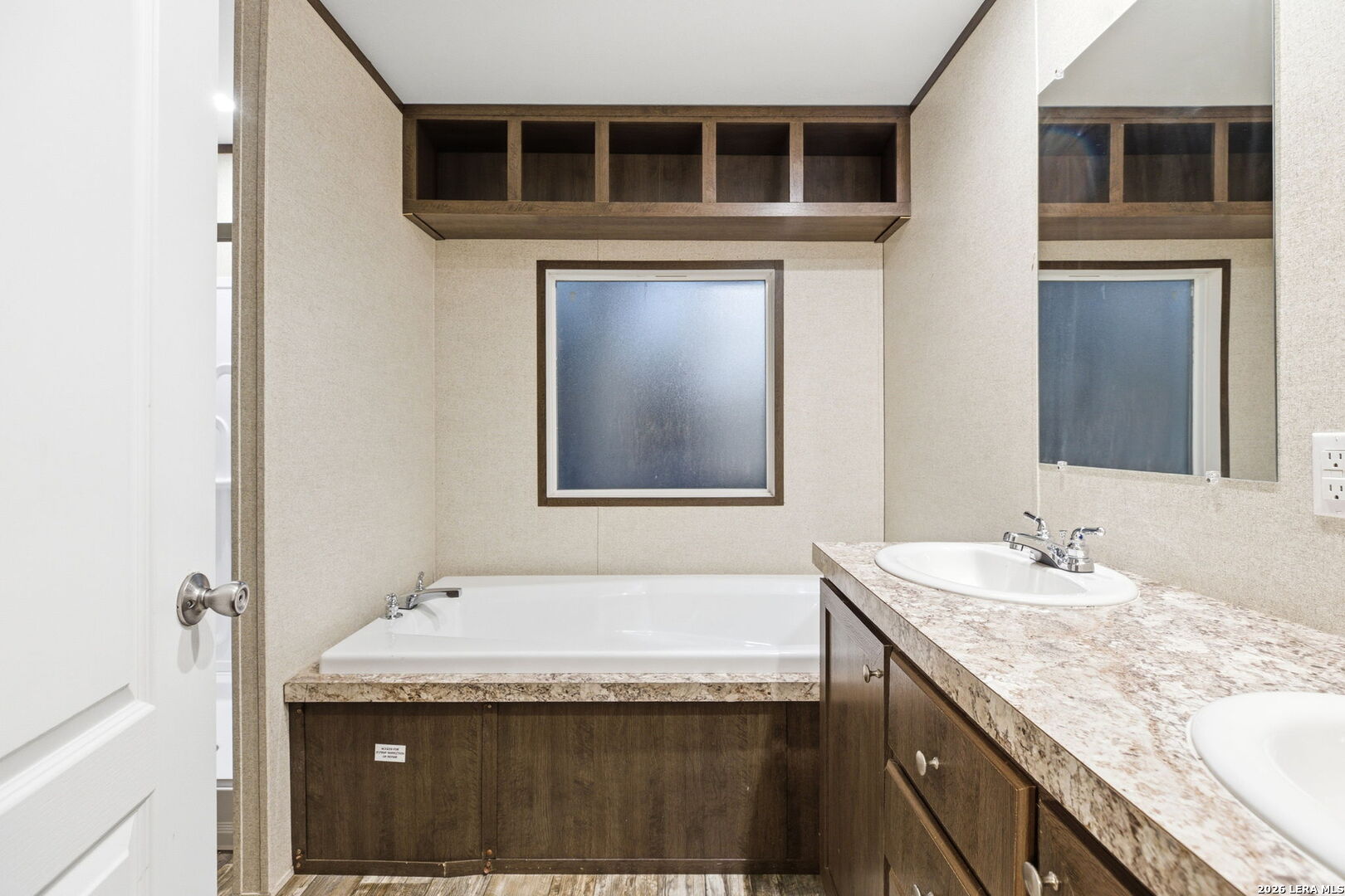 2383 Tomblin Road Bigfoot, TX 78005 - Photo 48 of 61 a bathroom with a granite countertop sink and a mirror