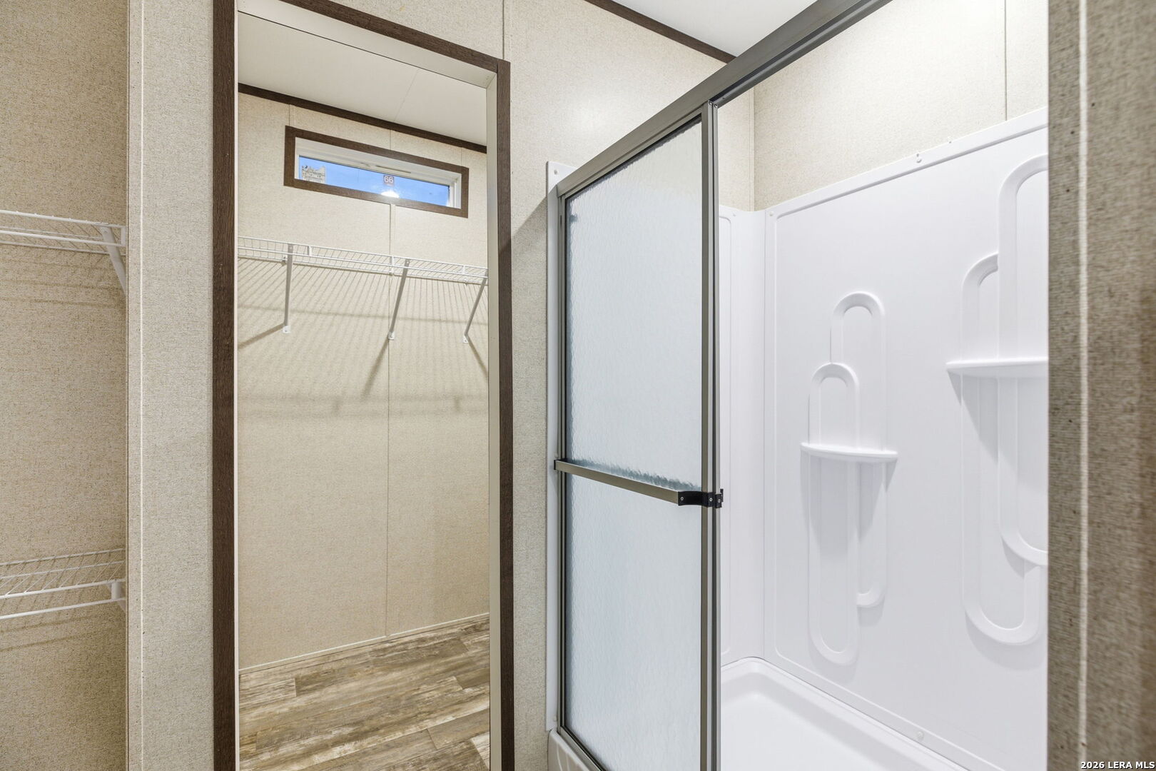 2383 Tomblin Road Bigfoot, TX 78005 - Photo 49 of 61 a bathroom with a glass shower door