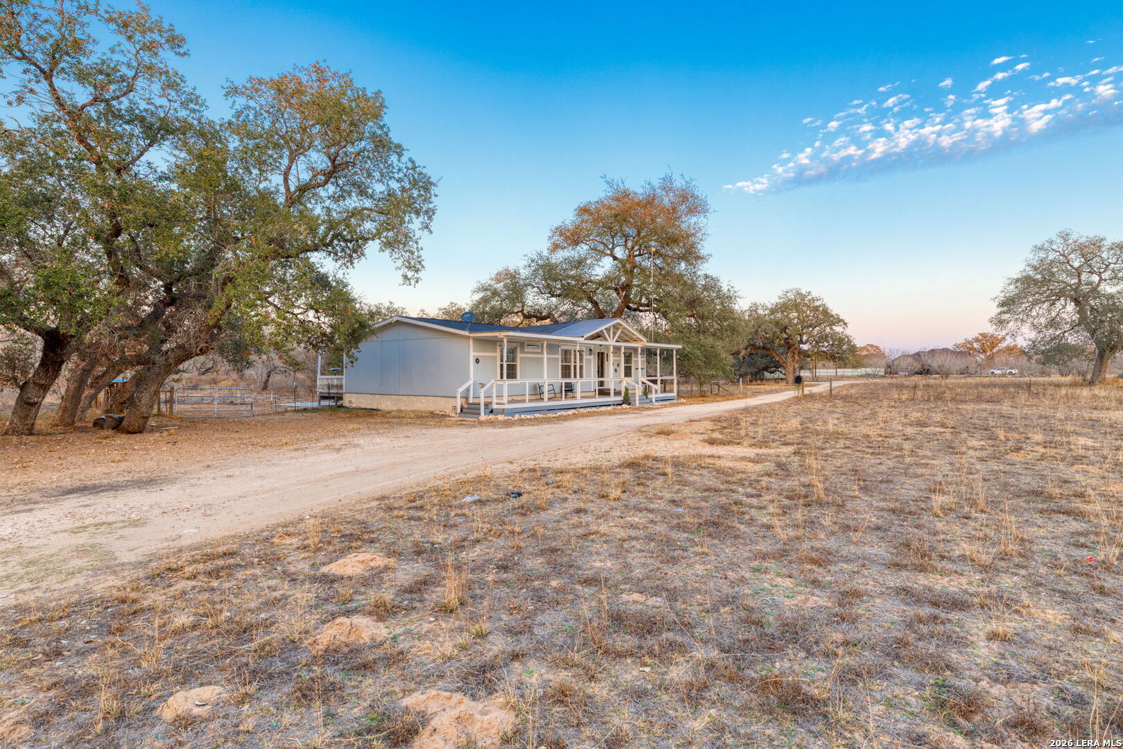 2383 Tomblin Road Bigfoot, TX 78005 - Photo 5 of 61 a house with trees in front of it