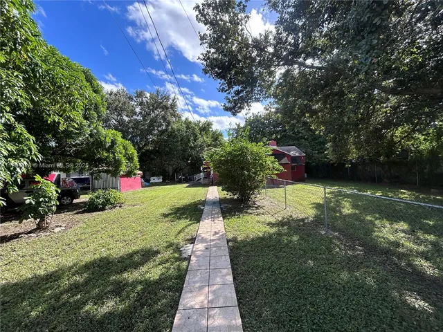 a view of a garden with a bench