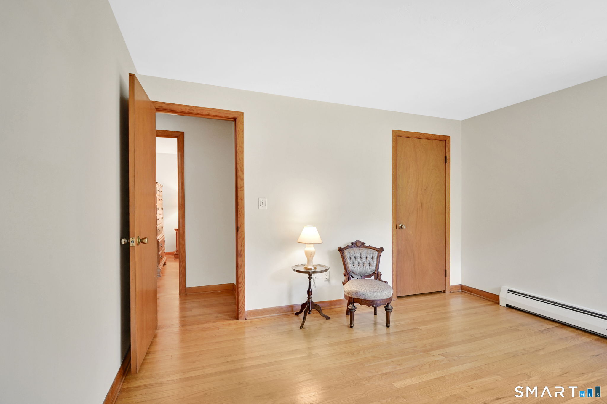 296 Phoenix Street Vernon, CT 06066 - Photo 19 of 34 a chair and a table in a room