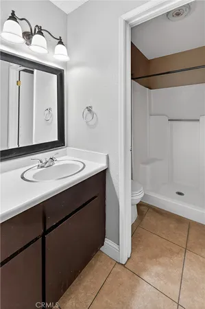 a bathroom with a sink a mirror and a shower