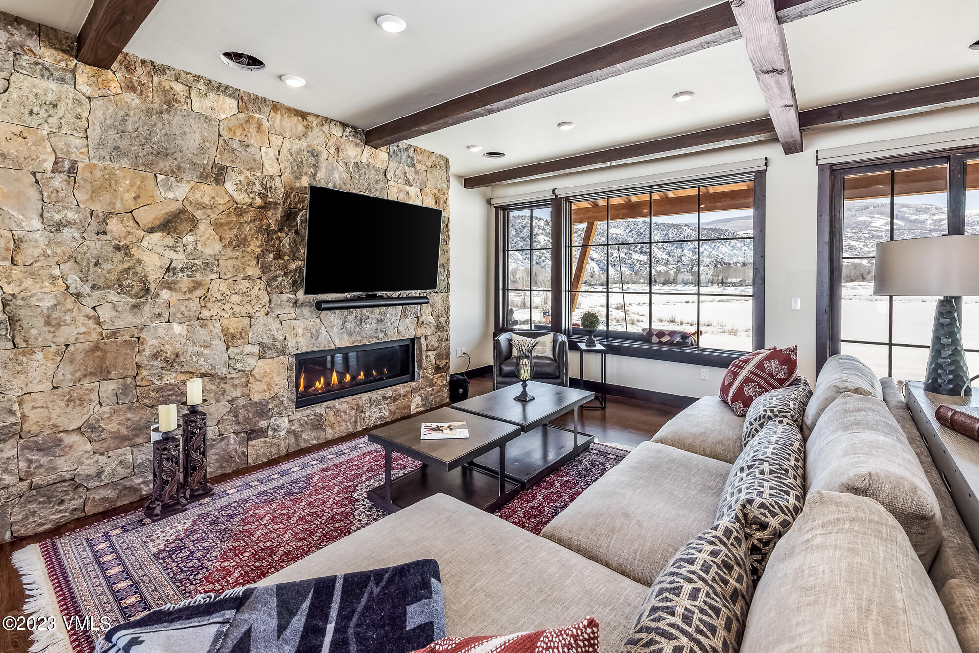 434 Hunters View Lane Eagle, CO 81631 - Photo 11 of 28 a living room with furniture a flat screen tv and a fireplace