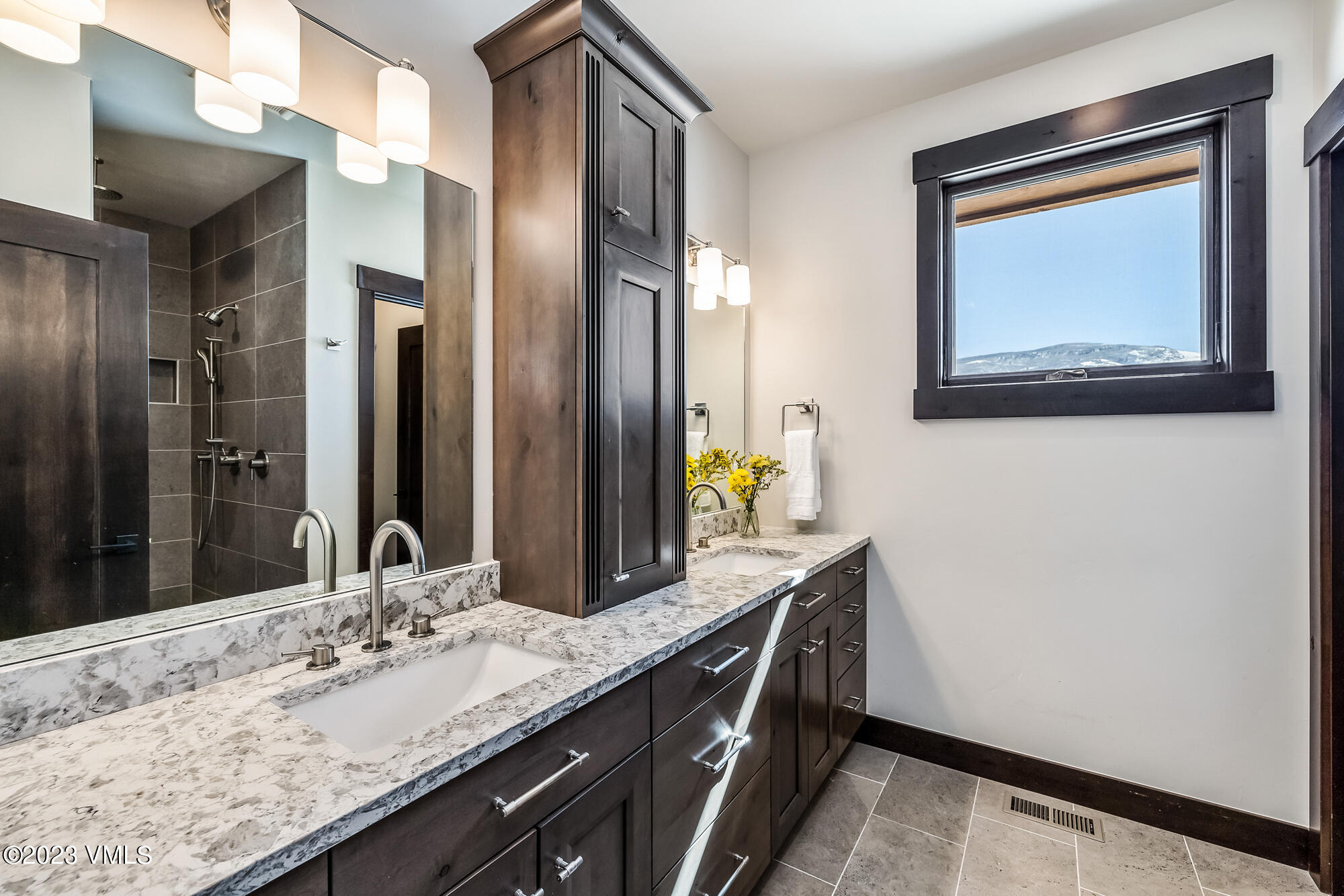 434 Hunters View Lane Eagle, CO 81631 - Photo 15 of 28 a bathroom with a granite countertop sink and a mirror