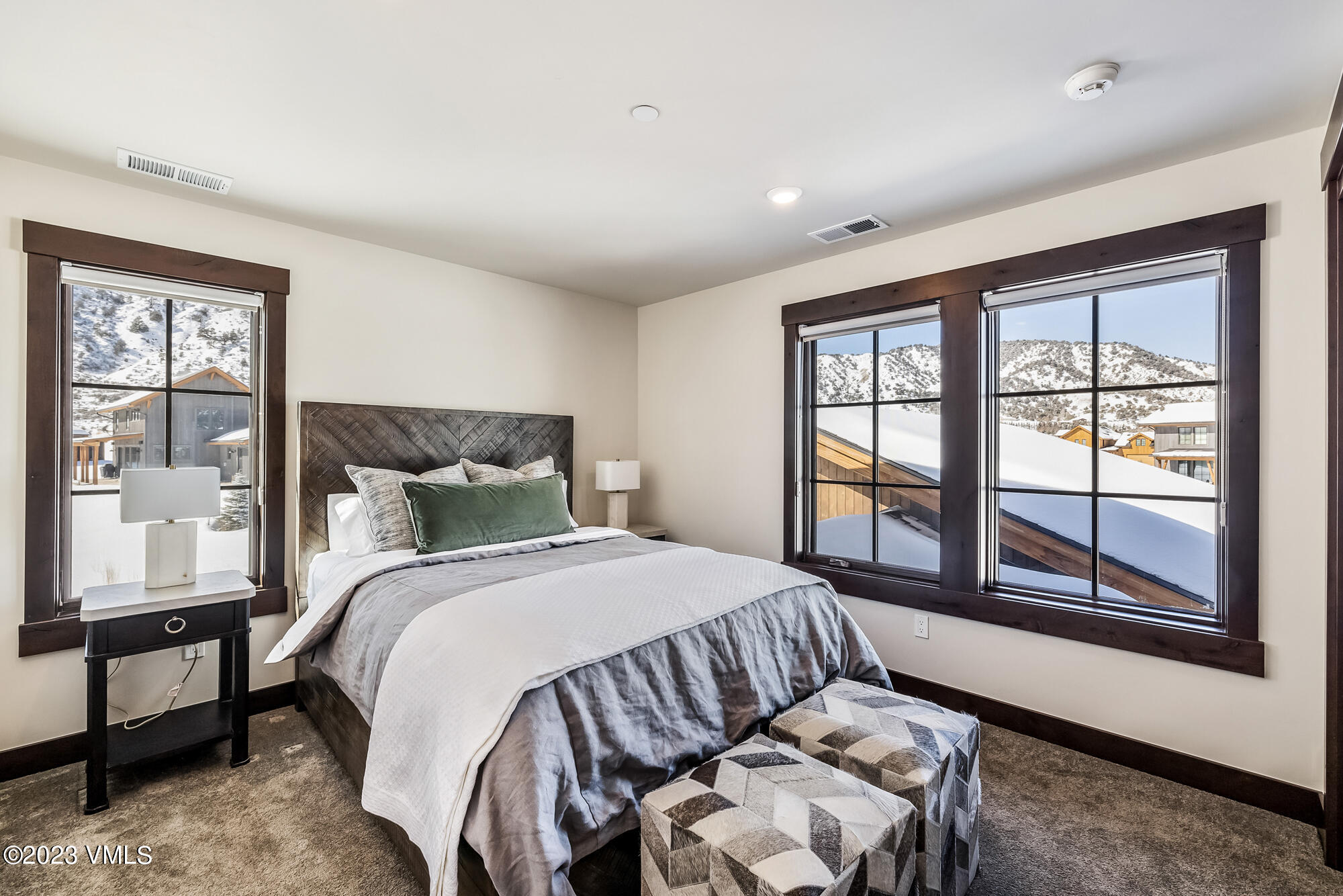 434 Hunters View Lane Eagle, CO 81631 - Photo 18 of 28 a bedroom with a large bed and a window with outer view